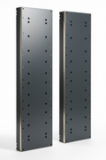 Knurr Side Panel Kit Steel Pair — Studio shot of panel pair propped upright showing steel face, powder-coat texture, mounting hole array, and RAL 7021 finish